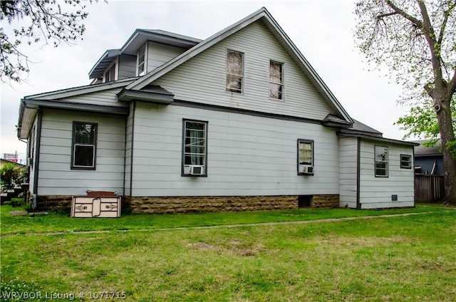 back of house featuring a lawn