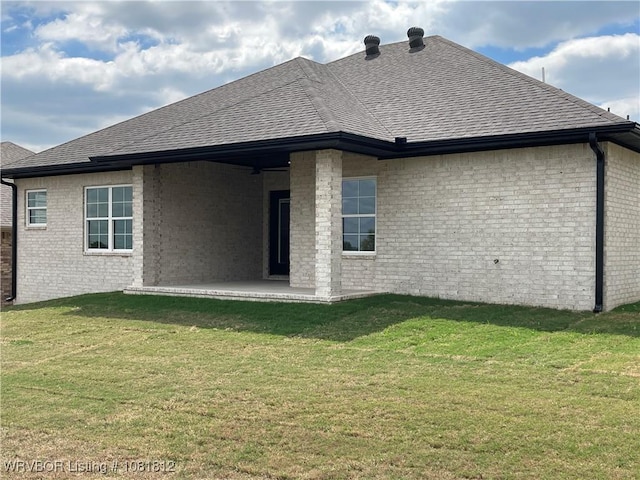 9109 Wayne Xing, Fort Smith, AR 72916 - back of property featuring roof with shingles, a yard, and brick siding
