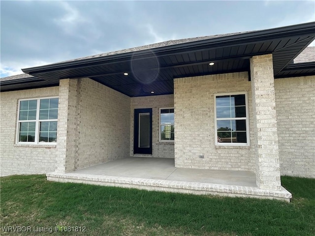 9109 Wayne Xing, Fort Smith, AR 72916 - rear view of property with brick siding and a patio