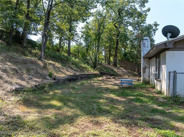 view of yard with cooling unit and fence