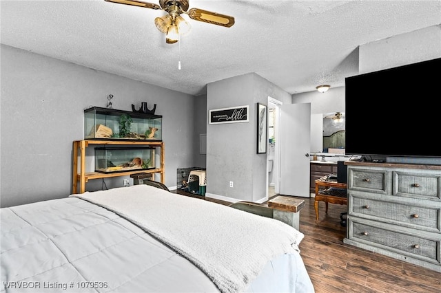 bedroom featuring a textured ceiling, a ceiling fan, baseboards, and wood finished floors