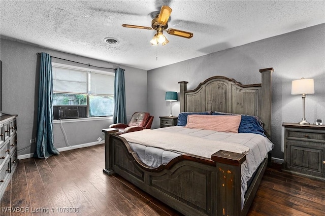 bedroom featuring visible vents, cooling unit, baseboards, dark wood-style flooring, and a textured wall