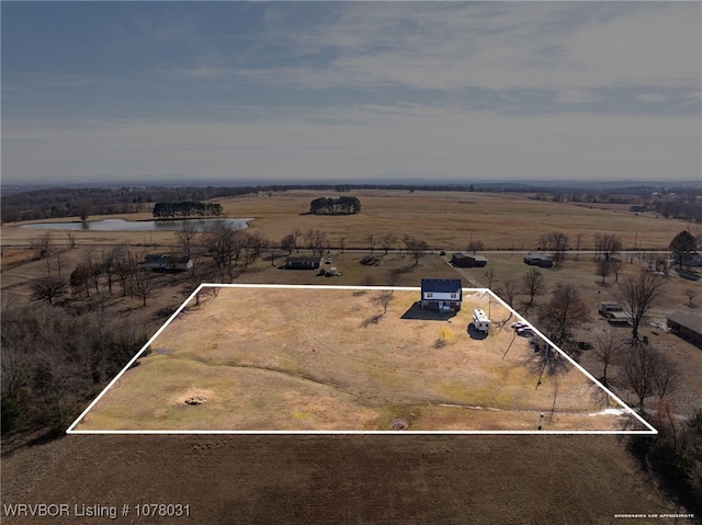 birds eye view of property featuring a rural view