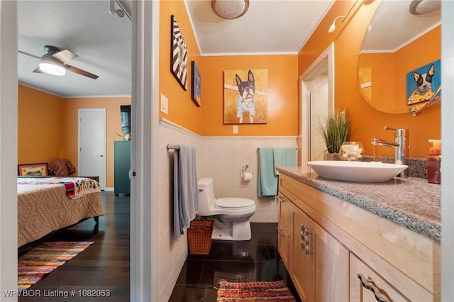 4110 S 34th St, Fort Smith, AR 72903 - bathroom featuring vanity, crown molding, a wainscoted wall, connected bathroom, and ceiling fan
