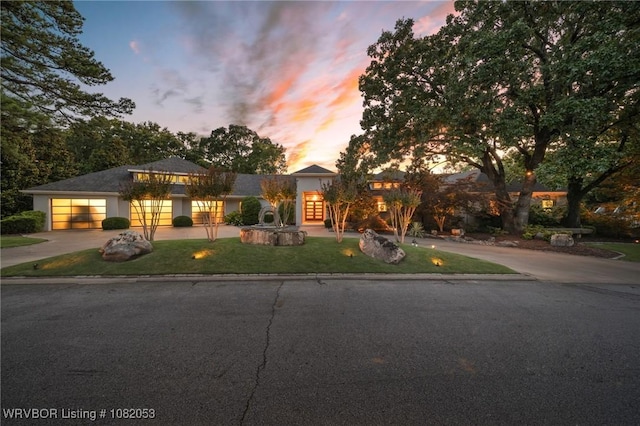 4110 S 34th St, Fort Smith, AR 72903 - view of front facade with concrete driveway, a yard, and an attached garage