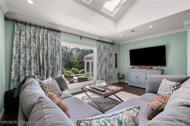 4110 S 34th St, Fort Smith, AR 72903 - living room featuring a skylight, recessed lighting, wood finished floors, ornamental molding, and vaulted ceiling