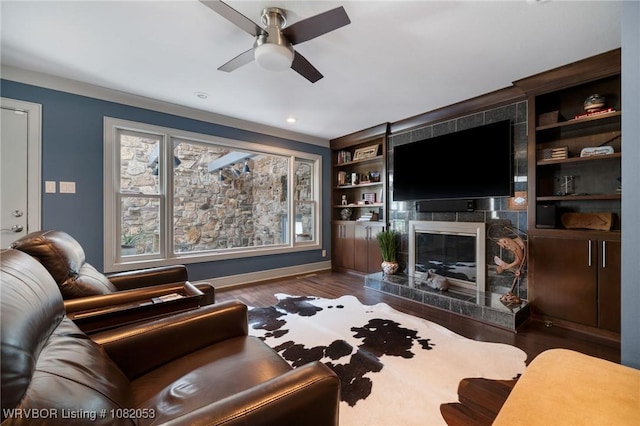 4110 S 34th St, Fort Smith, AR 72903 - living room featuring ceiling fan, a fireplace, wood finished floors, built in shelves, and recessed lighting