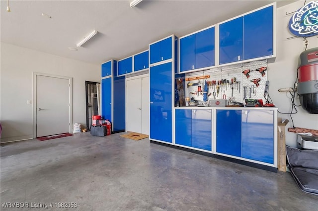 4110 S 34th St, Fort Smith, AR 72903 - garage featuring a workshop area and a central vacuum unit