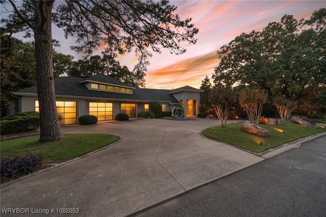 4110 S 34th St, Fort Smith, AR 72903 - prairie-style home featuring curved driveway, a lawn, and an attached garage