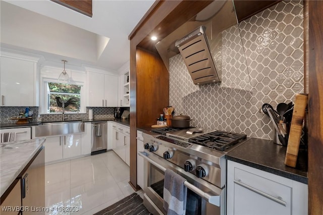 4110 S 34th St, Fort Smith, AR 72903 - kitchen featuring high end range, exhaust hood, tasteful backsplash, and white cabinets