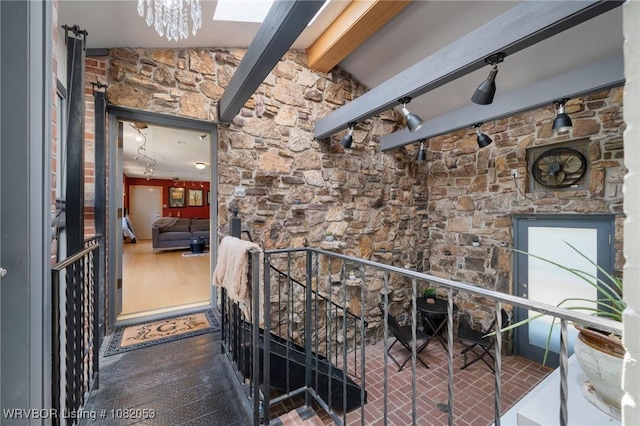 4110 S 34th St, Fort Smith, AR 72903 - hallway featuring beam ceiling, an upstairs landing, and a chandelier