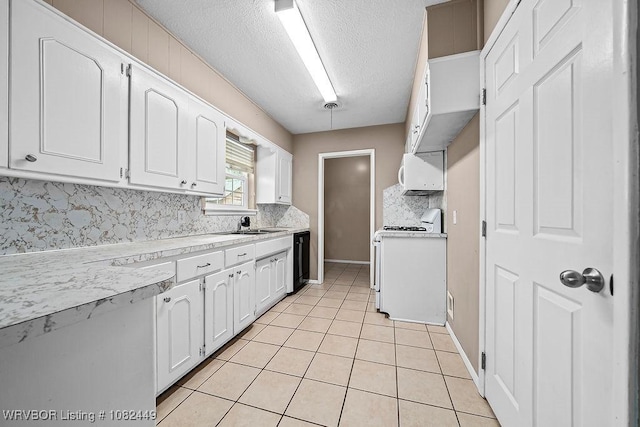 121 Dartmouth Ln, Fort Smith, AR 72908 - kitchen featuring tasteful backsplash, light countertops, white cabinets, and a textured ceiling