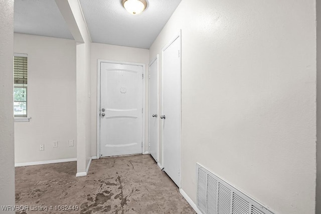 121 Dartmouth Ln, Fort Smith, AR 72908 - hallway with unfinished concrete floors and baseboards