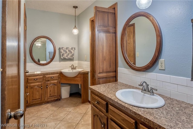 3001 Coral Cir, Alma, AR 72921 - bathroom featuring tile patterned flooring, two vanities, tasteful backsplash, and a wainscoted wall