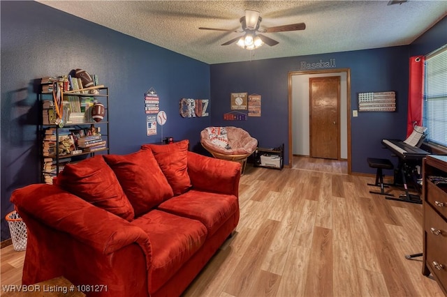 3001 Coral Cir, Alma, AR 72921 - living area featuring a textured ceiling, a ceiling fan, and wood finished floors