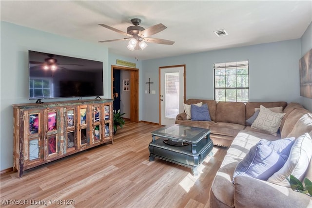 3001 Coral Cir, Alma, AR 72921 - living area with a ceiling fan, wood finished floors, and baseboards