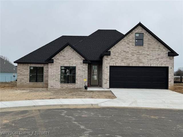 french country home with a garage