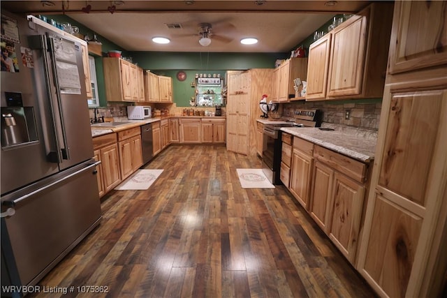 kitchen with stainless steel refrigerator with ice dispenser, dark hardwood / wood-style floors, range with electric stovetop, ceiling fan, and dishwashing machine