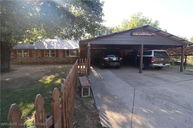 view of vehicle parking featuring a carport