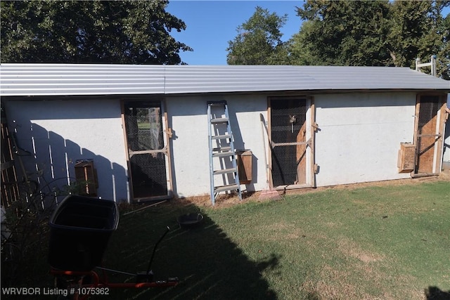 garage featuring a lawn