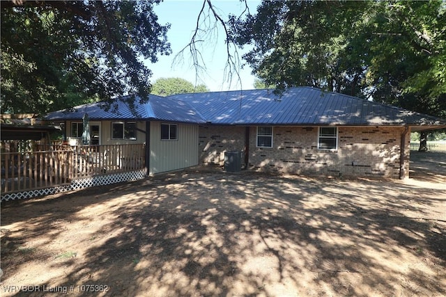 back of property featuring a wooden deck