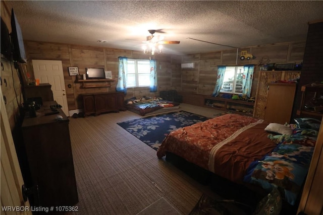 bedroom featuring ceiling fan and a textured ceiling