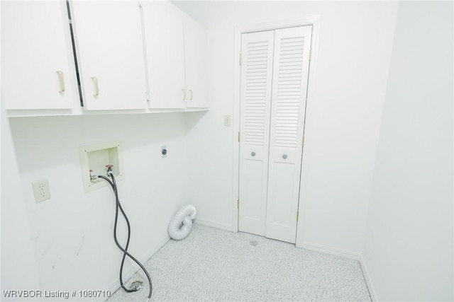 laundry area with cabinet space, electric dryer hookup, baseboards, and washer hookup