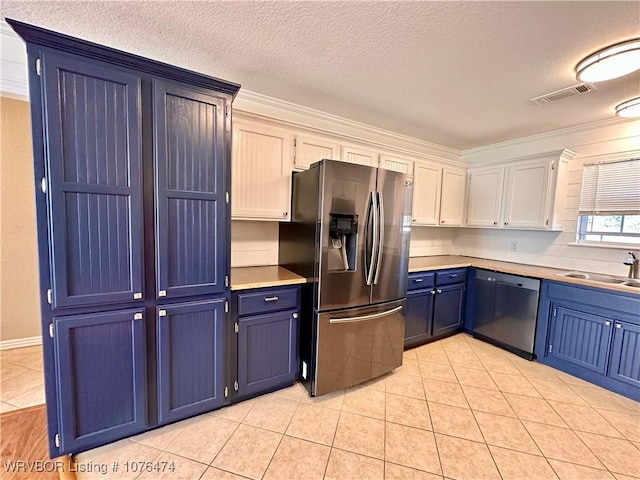 kitchen featuring blue cabinetry, sink, white cabinetry, stainless steel fridge, and black dishwasher