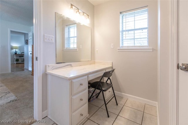 bathroom featuring tile patterned floors and baseboards