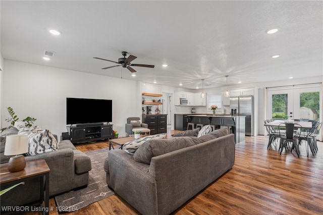 1723 N 52nd St, Fort Smith, AR 72904 - living room featuring recessed lighting, french doors, a ceiling fan, and wood finished floors