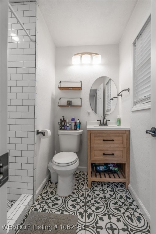 1723 N 52nd St, Fort Smith, AR 72904 - bathroom featuring vanity, tiled shower, and tile patterned floors