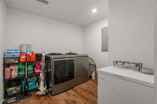 1723 N 52nd St, Fort Smith, AR 72904 - laundry area featuring separate washer and dryer, wood finished floors, electric panel, and recessed lighting