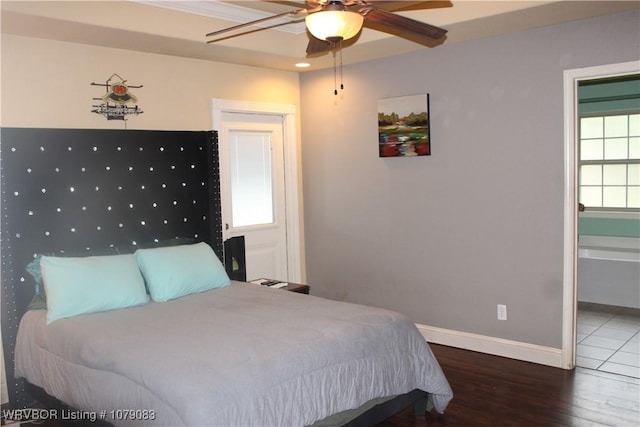 bedroom with ceiling fan and wood-type flooring