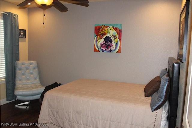 bedroom with ceiling fan and wood-type flooring