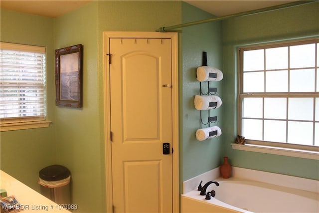 bathroom featuring a washtub