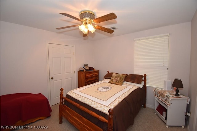 bedroom with carpet and a ceiling fan