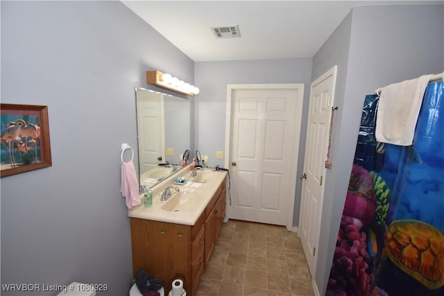 bathroom featuring vanity and baseboards