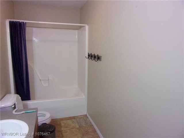 full bathroom with shower / tub combination, vanity, and toilet