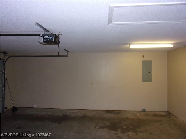 garage featuring electric panel and a garage door opener