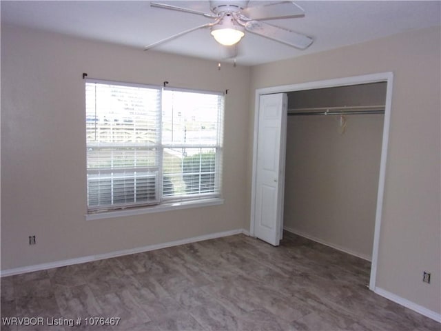 unfurnished bedroom featuring a closet and ceiling fan