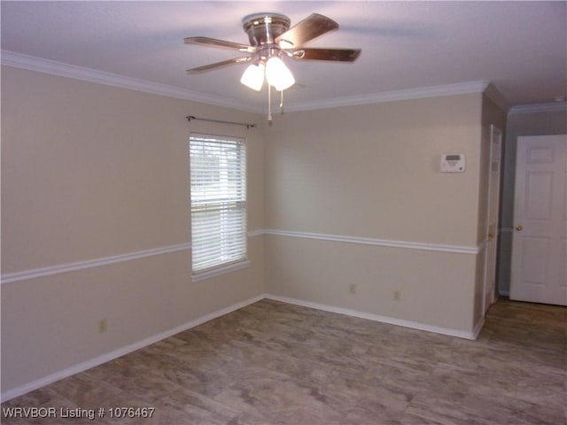 unfurnished room with ceiling fan and ornamental molding