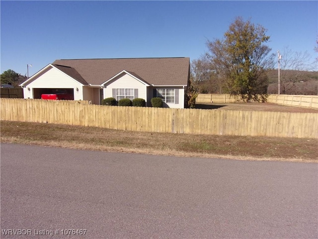 single story home featuring a garage