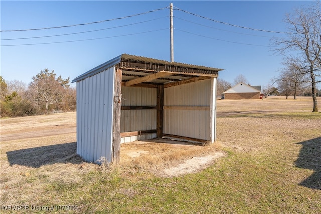 view of outdoor structure with a lawn