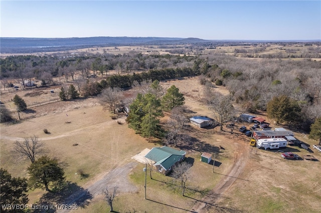 birds eye view of property with a rural view