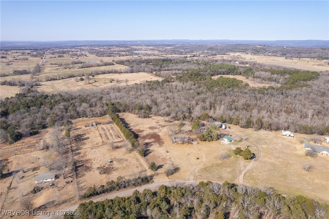 birds eye view of property with a rural view