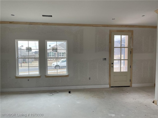 interior space with concrete flooring, visible vents, and baseboards