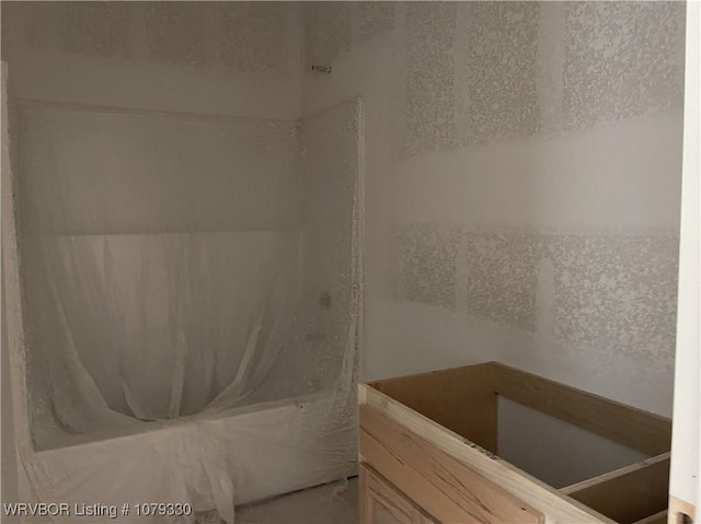 full bath featuring a tub to relax in and a shower