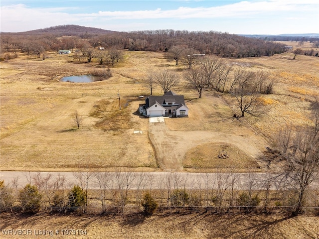 birds eye view of property with a rural view