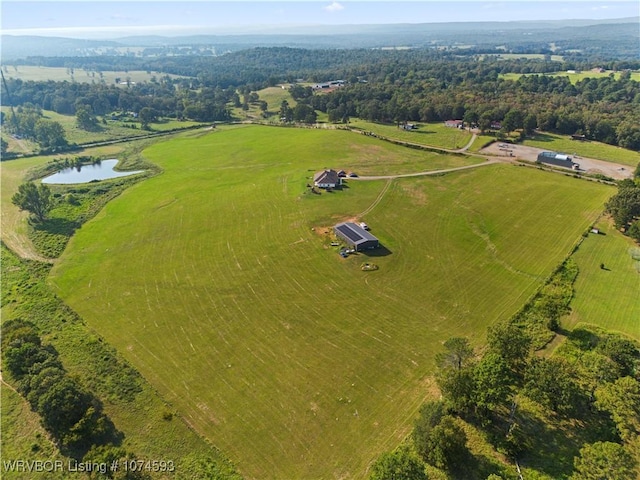 aerial view with a rural view and a water view