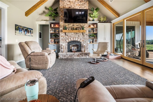 living room featuring a fireplace, lofted ceiling with beams, and hardwood / wood-style flooring